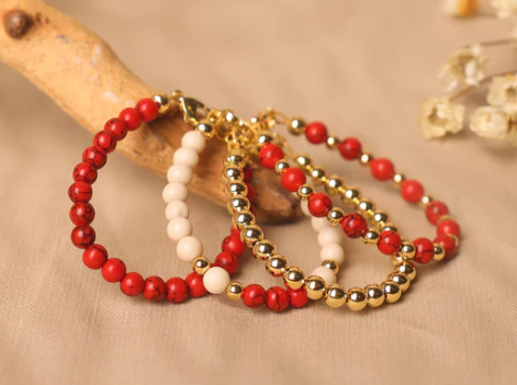 Red Stone with Gold Beads